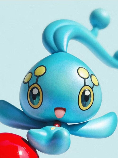 Front close-up of Manaphy's yellow-ringed eyes, smiling mouth and red chest accent, with a partial Poké Ball at the lower left.