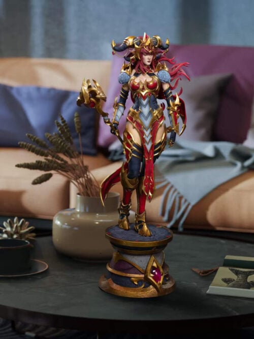 Full view of Alexstrasza on a round coffee table, with her jeweled pedestal in front of a sofa and cushions.