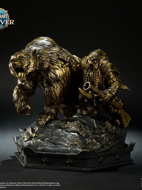 Bronze-colored dwarf hunter holding a rifle beside a roaring bear with a raised forepaw on a shared rocky base.
