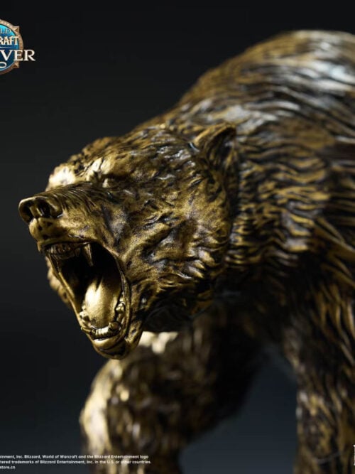 Close-up of the bronze-colored bear's open jaws, teeth and textured fur on the World of Warcraft statue.