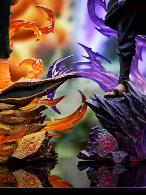 Close-up of Naruto's orange-accented, open-jawed head-shaped base beside Sasuke's spiked purple head-shaped base and curling effects.