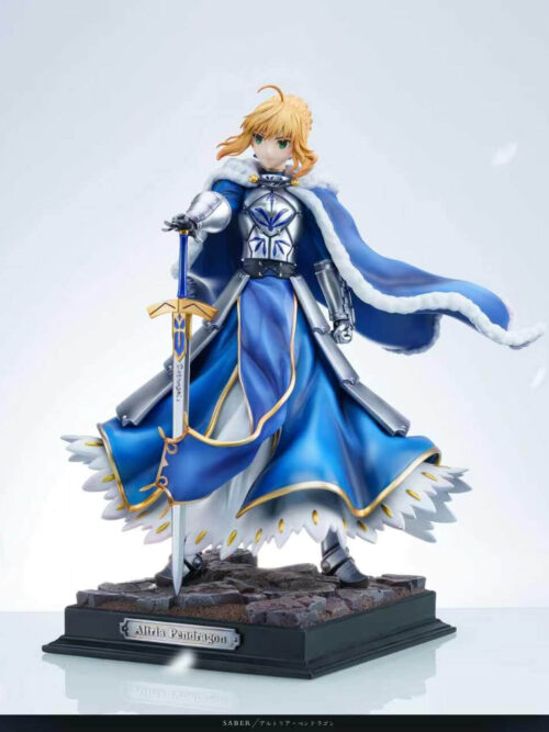 Three-quarter view of Altria Pendragon with a sweeping blue cloak, downward-pointing sword and stonework base bearing a nameplate.