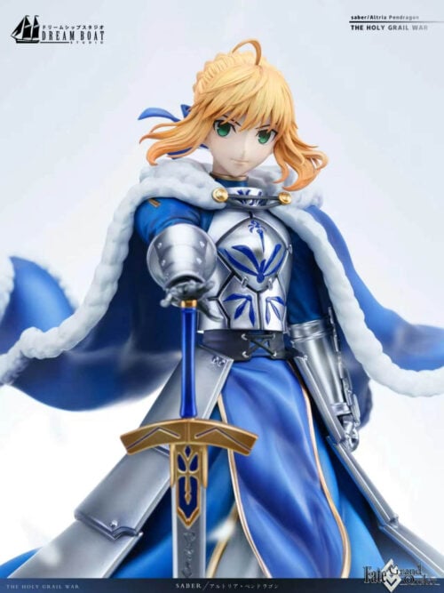 Close-up of Altria Pendragon's green eyes, swept blond hair, silver chest armor and armored hand resting on the sword pommel.