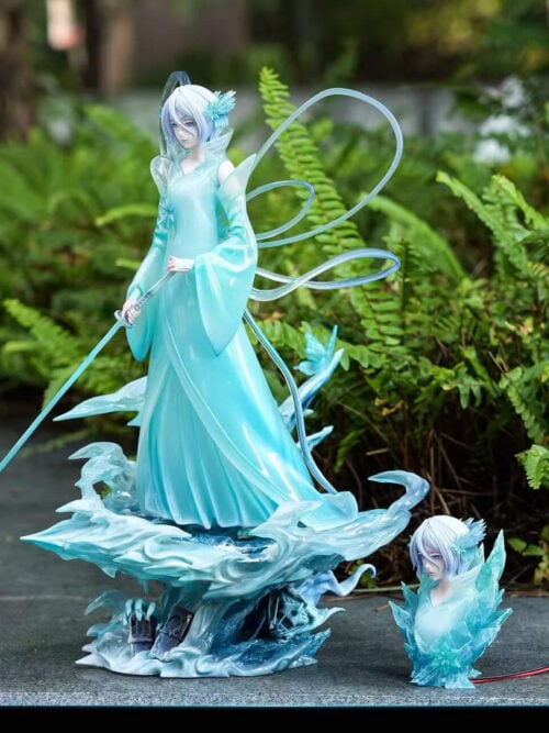 Rukia's full Bankai statue and separate accessory bust photographed outdoors in natural light, with the sword, ribbons and ice base visible.