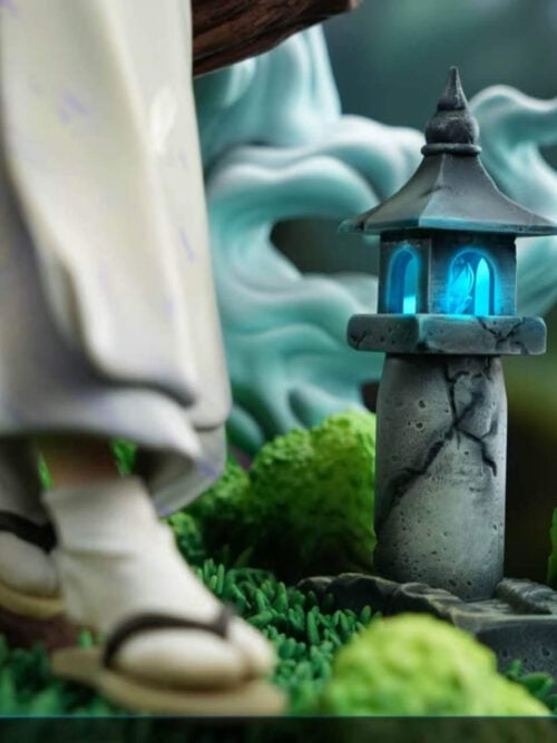 Stone-style lantern glowing blue beside Tomoe's sandal and moss-covered rocks, with a label stating that the lantern can light up.