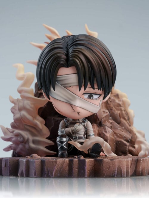Front view of chibi Levi Ackerman seated against jagged rocks, with facial bandages, a tear and curling smoke above the full rocky base.