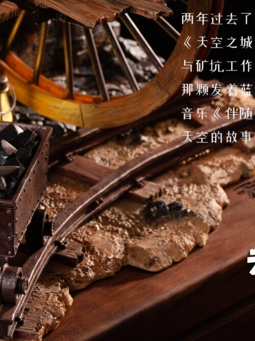 Close-up of a mine cart filled with dark rocks and a pickaxe on curved tracks, with a glowing lantern and wooden plinth.