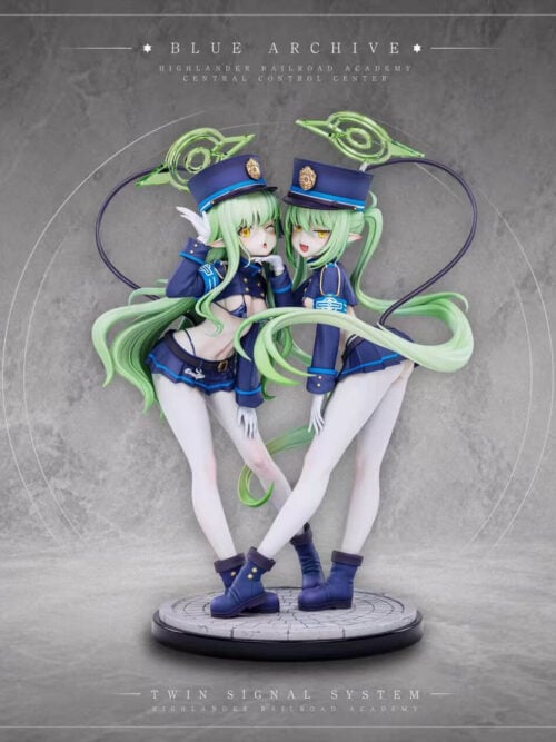 Hikari and Nozomi figures with green hair, blue conductor-style hats and green halos, shown together on a circular display base.
