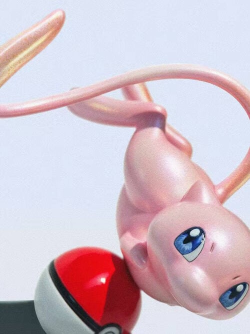 Close-up of Mew's blue eyes and pearlescent-looking pink surface, with its tail looping overhead beside a partially visible Poké Ball.
