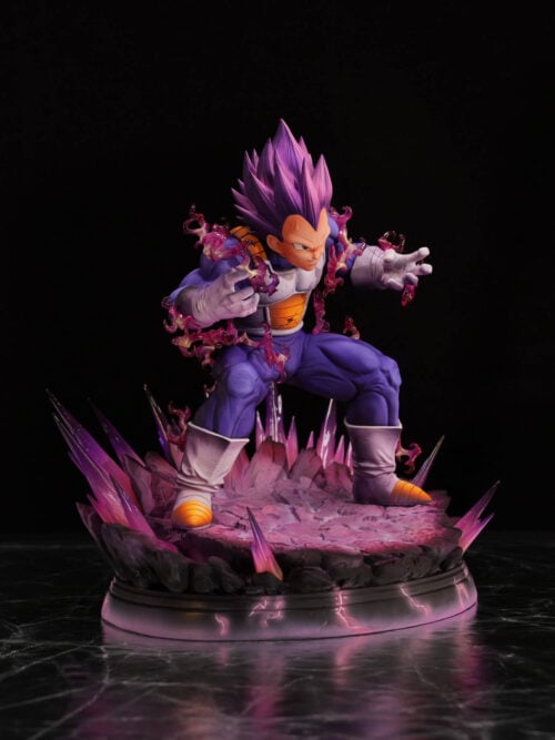 Three-quarter view of Ultra Ego Vegeta with spread gloved hands, damaged armor and pointed purple effects around a rocky base.