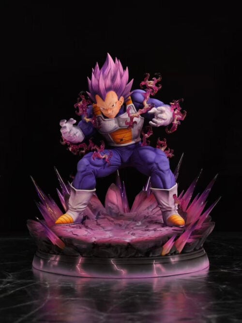 Front view of Ultra Ego Vegeta in a low stance, with pink-purple aura parts and a complete rocky display base against black.