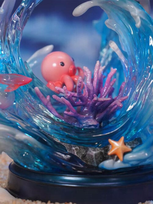 Ocean base detail with a pink octopus, purple coral, a red fish and an orange starfish surrounded by blue waves and white foam.