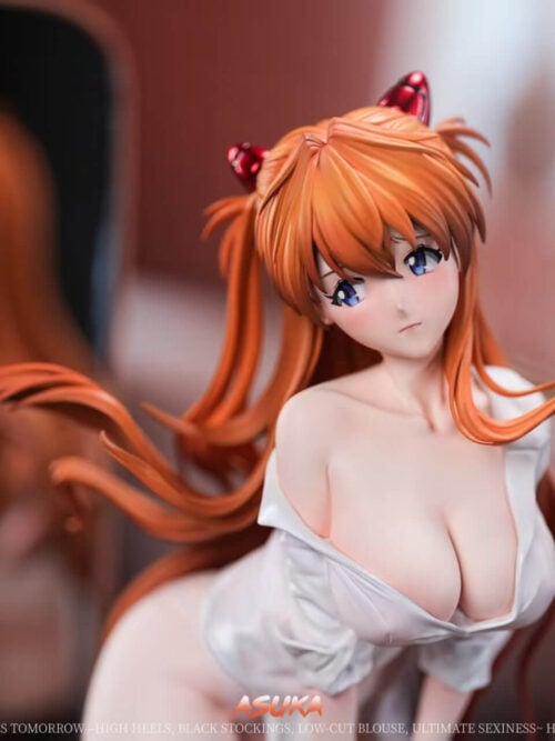 Close-up of the Asuka figure's face, blue eyes, orange hair and red hair clips, with a mirror behind.