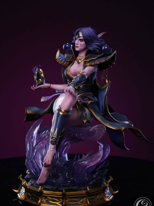 Three-quarter view of Xal'atath seated above curling purple effects, with flowing blue-and-gold costume panels and an ornate base.