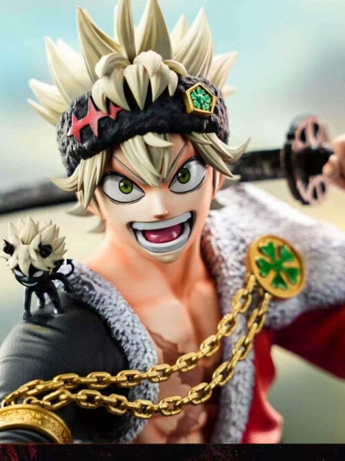 Close-up of Asta's grin, green eyes, katana across his shoulders, gold-colored chains and small horned companion.