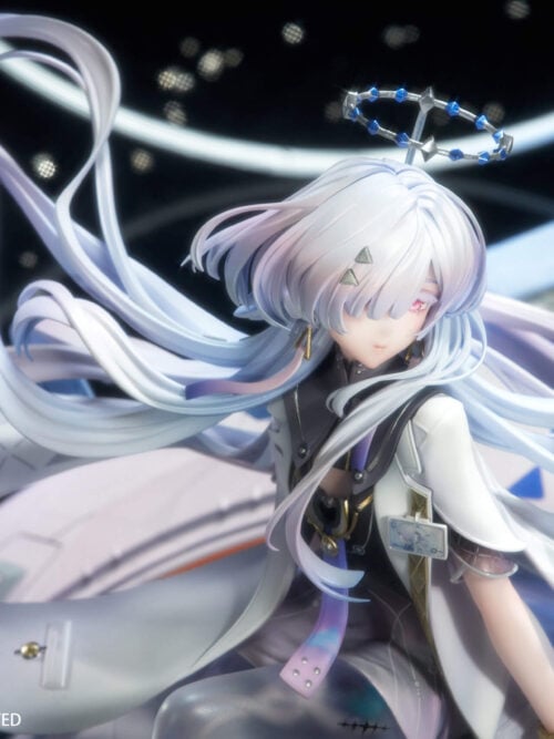 High-angle close-up of Mornye's face, pale curling hair, blue-and-silver ring ornament and white coat.