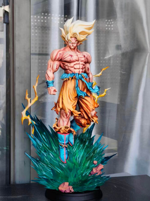 Front view of Son Goku hovering above jagged teal energy effects and rocks on a black circular base, with yellow lightning at his sides.