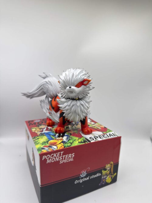 Front view of Original Studio's Arcanine figure on an illustrated box, showing a white mane and black collar with gold-colored studs.