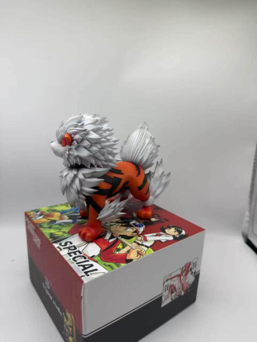 Arcanine figure facing left on an illustrated box, with pointed white fur around the head and legs and black stripes across the orange body.