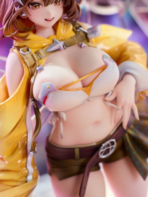 Close-up of Anis's white top, yellow jacket, star-shaped trim, belt buckle and patterned fabric at her hip.