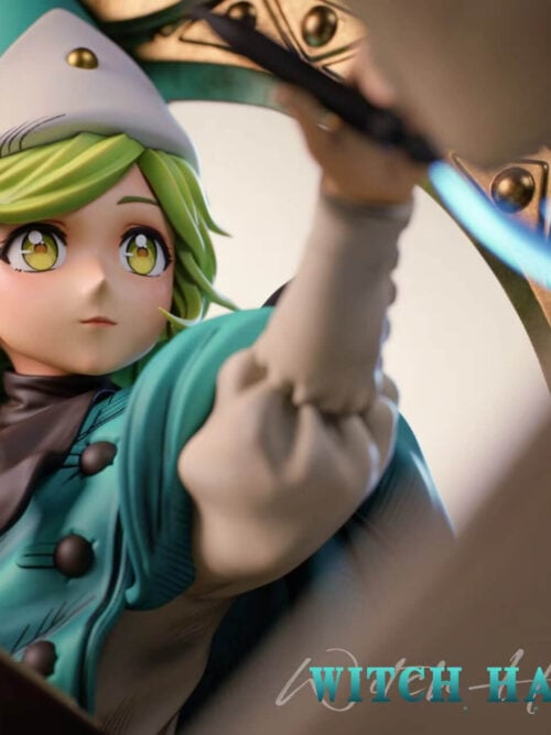 Close-up of Coco's yellow-green eyes, swept green hair, pointed hat and teal cape, with her raised arm beside the gold-toned frame.