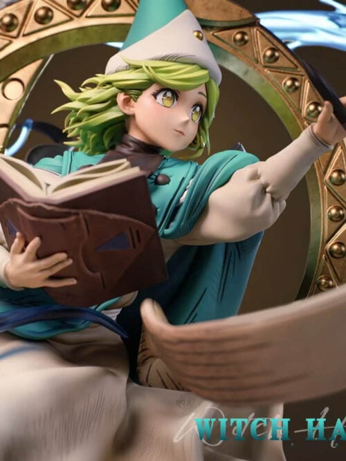 Coco holding an open brown book and extending a black pen toward a curling scroll, surrounded by a teal cape, gold-toned ring and blue effects.