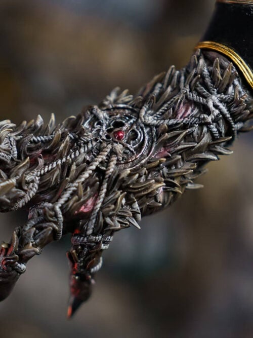 Close-up of Maliketh's outstretched claw with rope-like bindings, pointed textures and a small red inset detail.