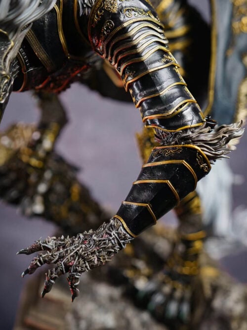 Maliketh's layered black arm armor with gold-colored trim, exposed fur at the elbow and an extended bound claw.