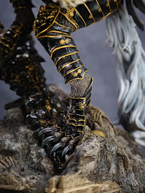 Maliketh's gold-edged black shin armor and dark claws against broken stone, with a long white tail behind.