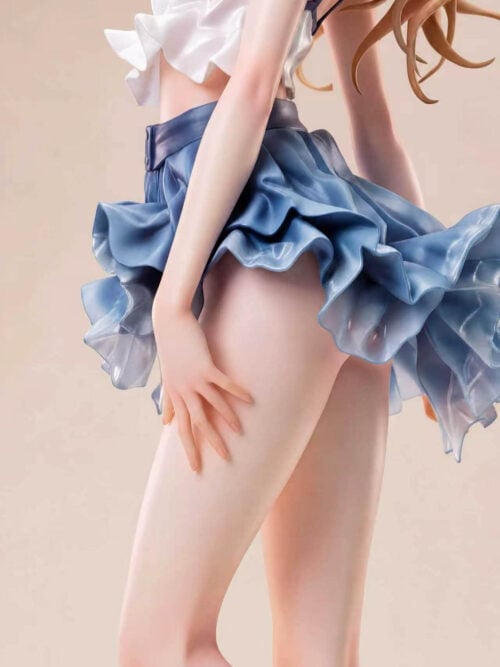 Close-up of the Asuka Langley figure's blue-trimmed white top, layered blue skirt ruffles and flowing hair.