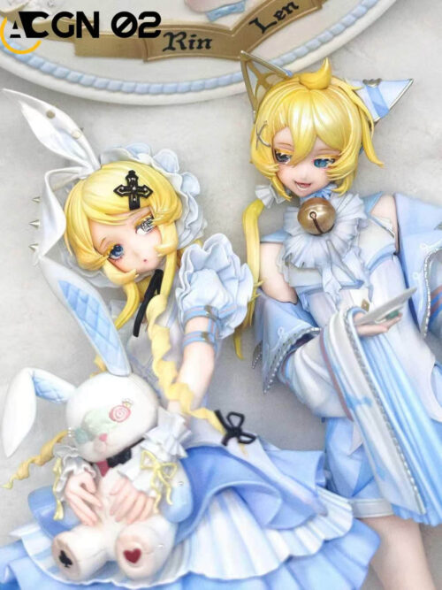 Close-up of blue-and-white Kagamine Rin and Len lying side by side, showing Rin's rabbit doll and Len's bell and pleated sleeves.