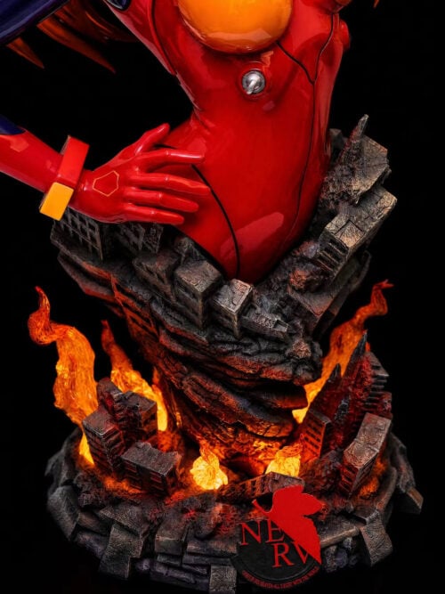 Close-up of Asuka's red glove and lower torso above layered ruined buildings, glowing orange flames and a red-and-black NERV emblem.