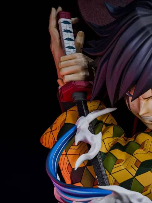 Angled close-up of Giyu Tomioka gripping his sword beside his head, with swept dark hair and white-tipped blue water effects.
