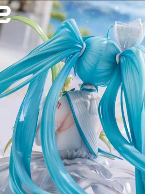 Rear detail of Hatsune Miku's sweeping turquoise twin-tails, silver-white hair bow and teal-edged back panels.