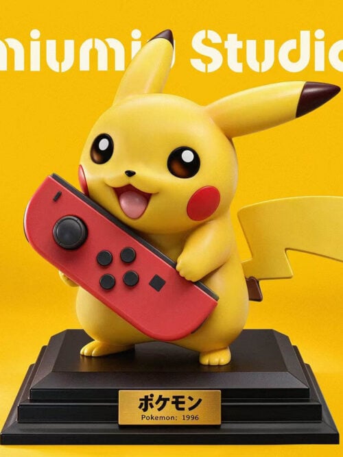 Yellow Pikachu holding a red controller on a stepped black base with a gold-colored nameplate.