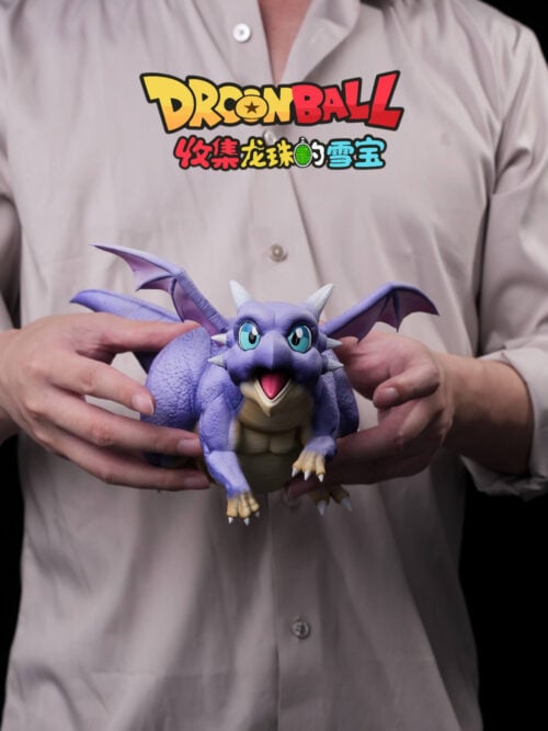 A person holds Icarus with spread purple wings and an open mouth; Son Gohan and the scenic base are not shown.