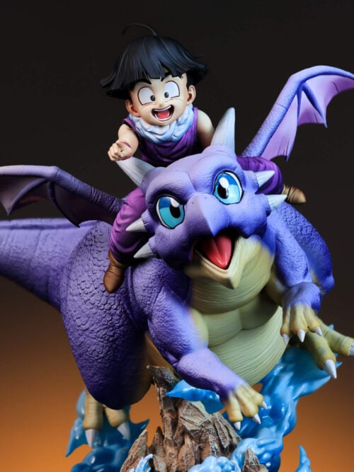 Front detail of smiling Son Gohan pointing ahead on Icarus, with purple wings and part of the rocky effect base visible.
