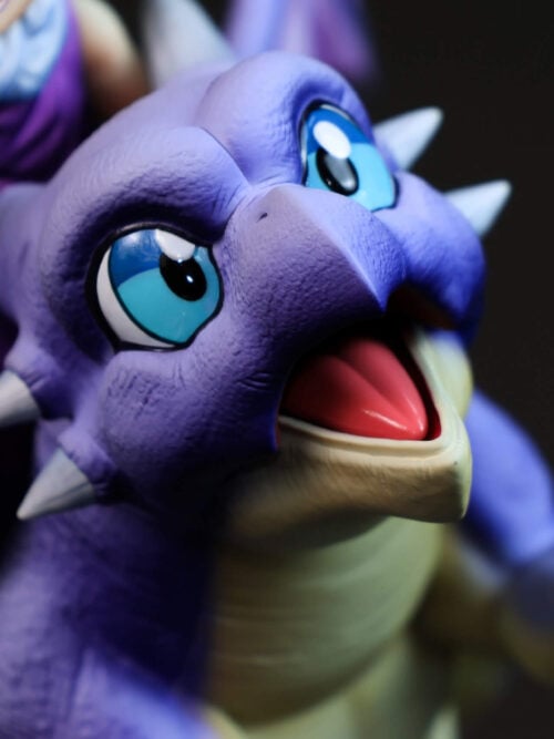Close-up of Icarus's blue eyes, lavender face, pale horns and open mouth, with part of Son Gohan visible behind.