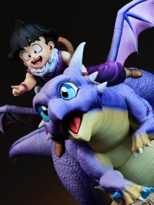 Three-quarter close-up of Son Gohan leaning over Icarus, showing the dragon's blue eyes, textured scales and cream underside.