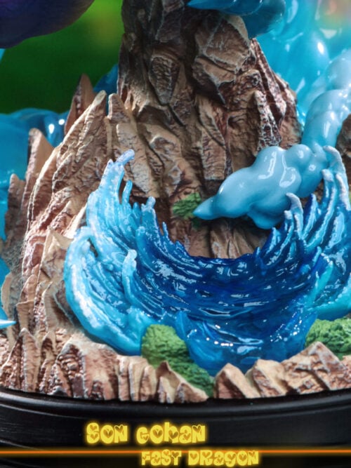 Detail of the statue's rocky base with curling blue waves, green vegetation and pale blue swirling effects.