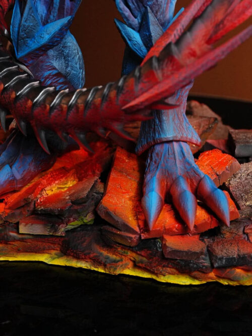 Close-up of Obelisk the Tormentor's clawed blue feet planted on the fractured rock base with glowing lava-style lighting beneath Slifer's coiled tail