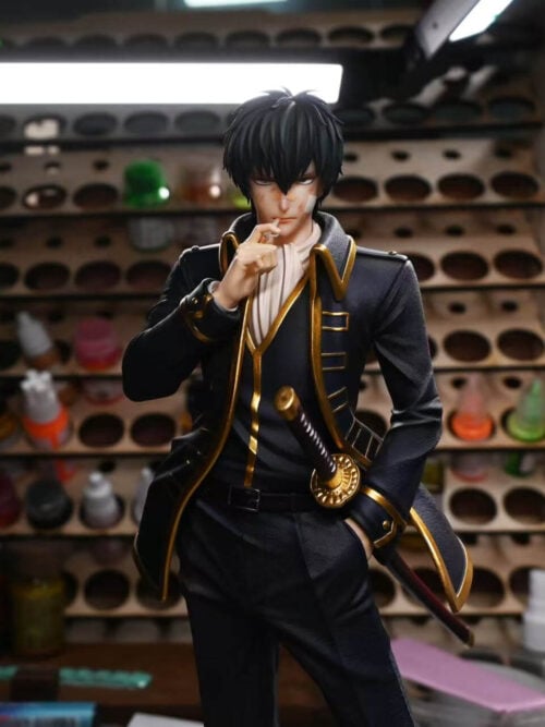 Upper-body front view of the Toushirou Hijikata statue fitted with the battle-damaged head sculpt featuring bandages across the nose and left cheek as he holds a cigarette