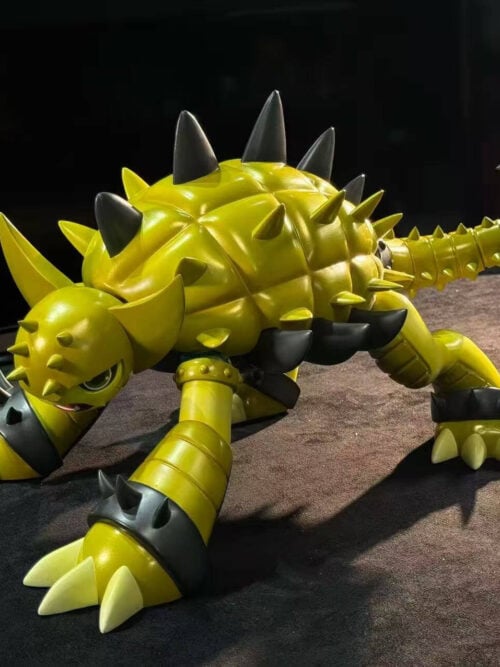 LD Studio Ankylomon figure from Digimon Adventure 02 in a low four-legged stance, seen from the front-left with a segmented yellow shell, dark grey dorsal and ankle spikes, and a raised grey spiked tail mace.