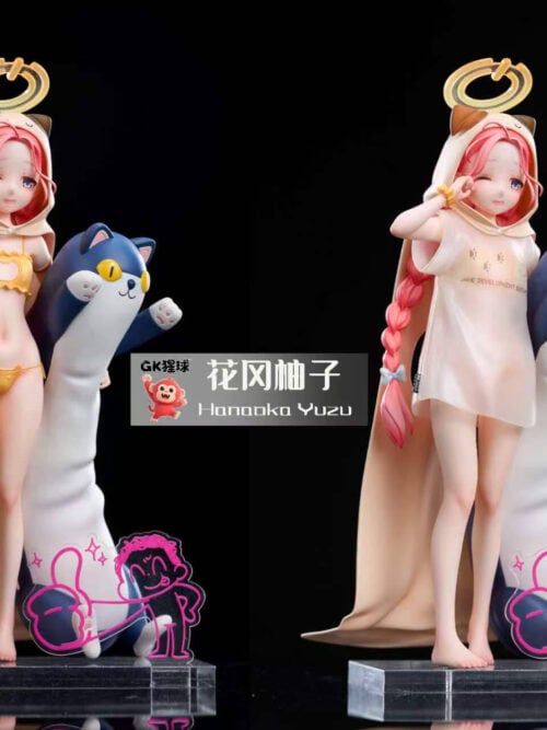 Full-length side-by-side comparison of GK XingQiu Studio's 1/7 scale Hanaoka Yuzu statue on a clear base, displayed in her yellow two-piece outfit on the left and with her detachable oversized white T-shirt on the right beside a tall blue-and-white plush companion