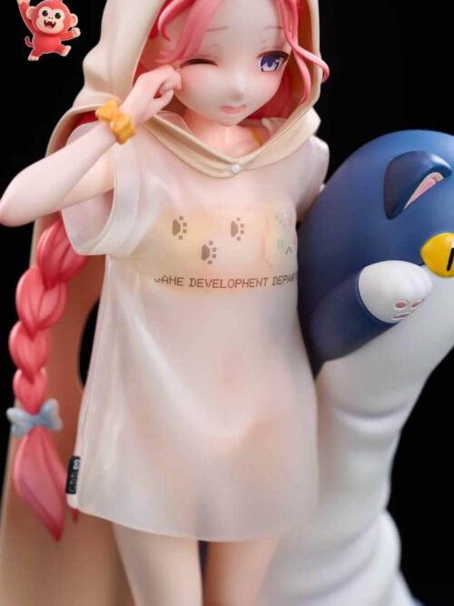 Close-up front view of GK XingQiu Studio's 1/7 scale Hanaoka Yuzu statue from Blue Archive wearing a beige cat-eared hooded cape and semi-sheer oversized white T-shirt beside a blue-and-white plush companion