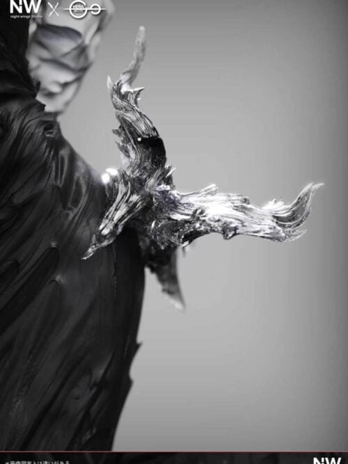 Close-up detail of the dark semi-translucent swirling effect piece extending from the hip of the Death Devil Fami statue against her black dress.