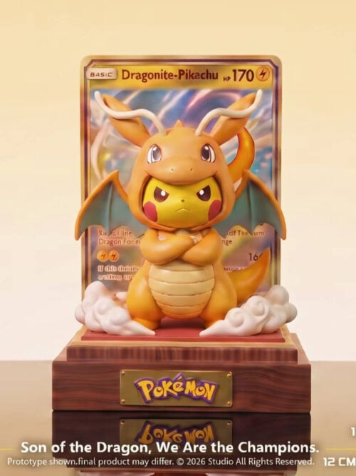 Front studio view of Peak Studio Pikachu in a Dragonite costume with trading card backdrop and wood base, labeled 17 cm high by 12 cm wide by 12 cm deep.