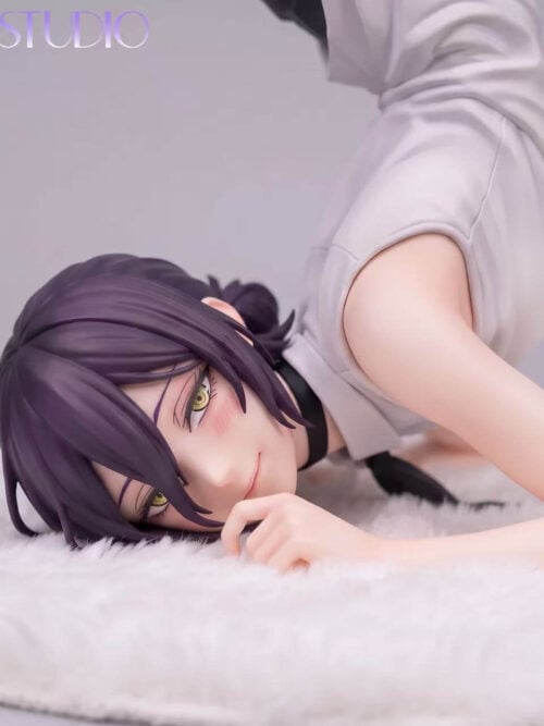 Close-up of BA Studio 1/6 scale Reze statue showing her head, sleeveless white top, black ribbon tie, and forearms resting on a white plush mat
