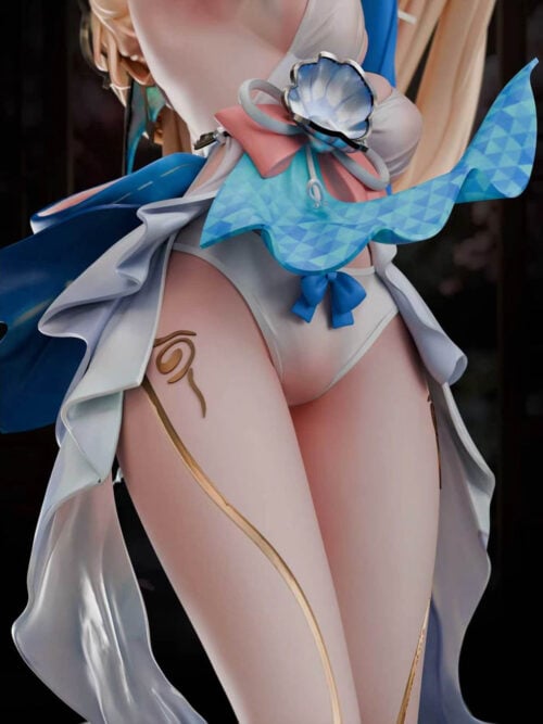 Close-up of the Pearl statue's waist and thighs showing an iridescent shell ornament over a pink bow, checkered blue sash, ruffled white skirt, and gold thigh markings.