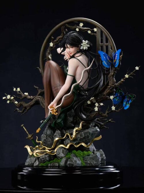 Three-quarter view of Tianyi He in an open-backed green dress, holding a wavy-bladed sword above a rocky base with gold-colored flourishes.